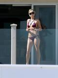 Paris Hilton in bikini in Malibu at a beach party