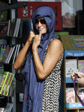 Paris Hilton Covering Her Head with a Purple Scarf in Malibu