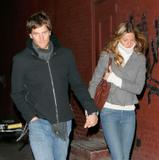 Gisele Bundchen in tight jeans and boots