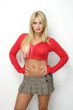 Brooke Hogan busty and leggy in short mini skirt and tiny red top showing her fit stomach in promos for her reality show 